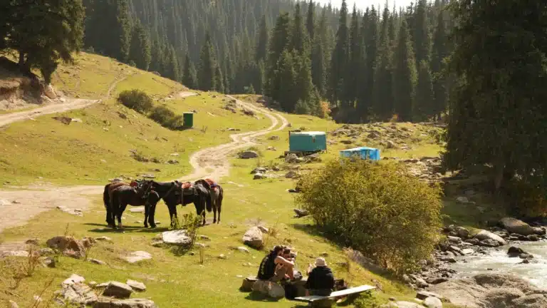 Horse riders resting in Altyn Arashan mountain valley