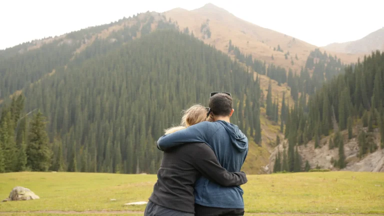 Couple are enjoying the view of the nature in Kyrgyzstan